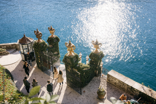 Tourists visiting villa del balbianello on lake como, italy