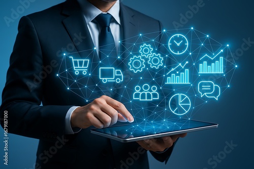 Business intelligence concept with a manager using a tablet and a holographic brain of interconnected operational icons.