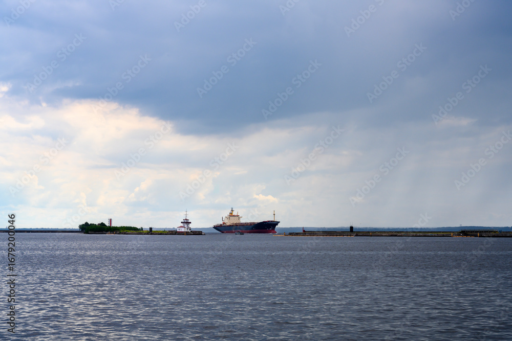 Fototapeta premium Cargo ship in the bay in the city of Kronstadt