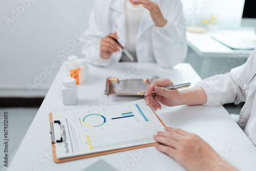Medical professionals examining test results and having a discussion about the data in a laboratory setting