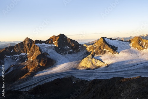 Wallpaper Mural Picturesque high mountain landscape at sunrise with alpenglow, glacier and rocky mountain peaks in the morning light, view of the Königshofspitz mountain peak and Übeltalferner glacier, Stubai Alps, South Tyrol, Italy Torontodigital.ca