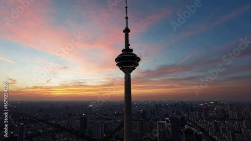 Milad tower rises above tehrans skyline at dusk, a modern landmark