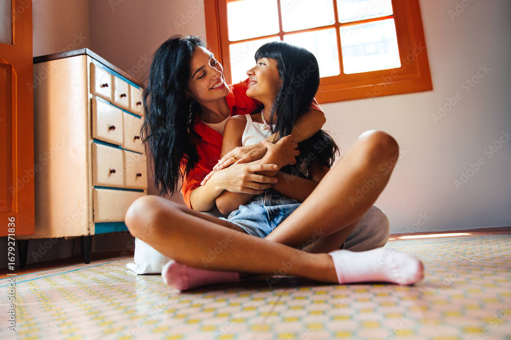 custom made wallpaper toronto digitalHappy mother and daughter embracing on a colorful tiled kitchen floor