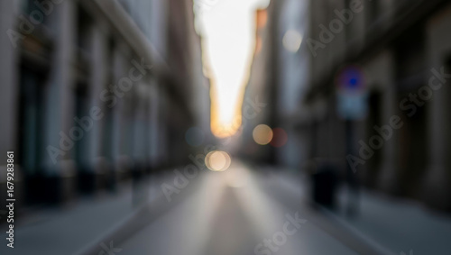 Wallpaper Mural Blurred street view between buildings with light at the end of the road, where glowing brightness enhances depth and creates a dreamy perspective in the city. Torontodigital.ca