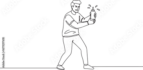 Frustrated man struggles with squirting condiment bottle in cont