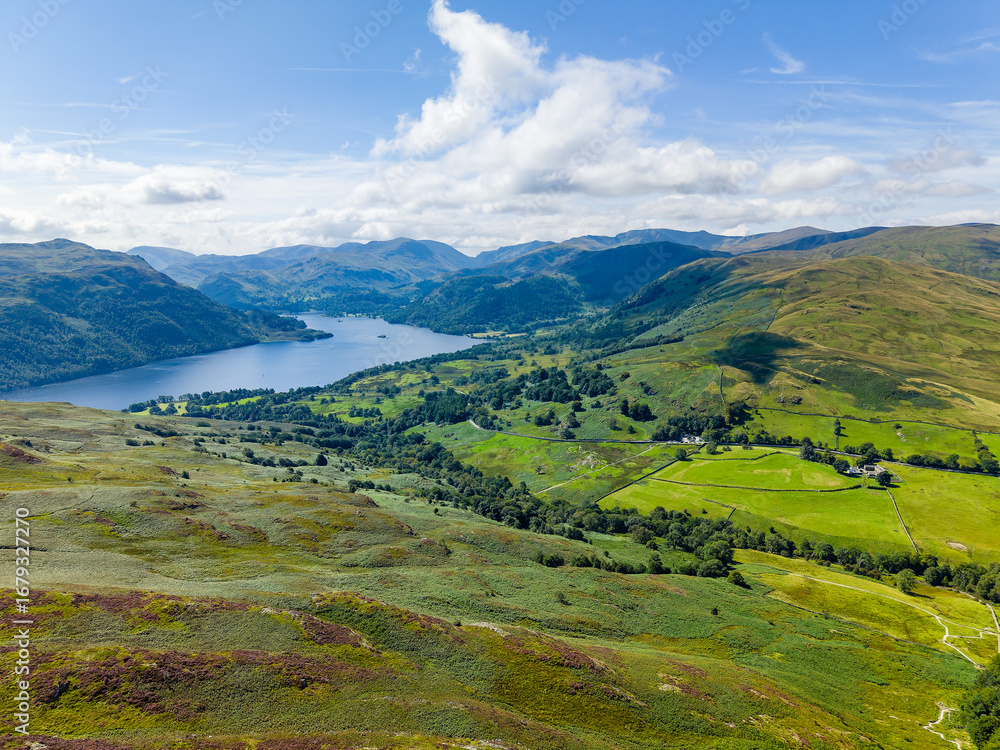 Fototapeta premium Aerial drone view of Ullswater lake and surrounding fells in the Lake District, UK