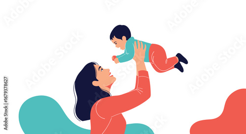 A mother holds her baby up high in a joyful celebration