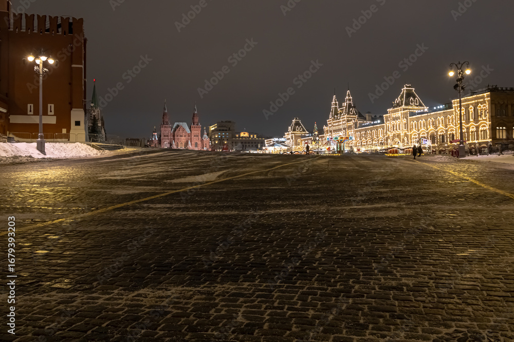 Fototapeta premium Festive New Year's illumination of buildings located on Red Square in Moscow. Winter on Red Square. Paving stones on Red Square. Lighting during the New Year holidays in Moscow.