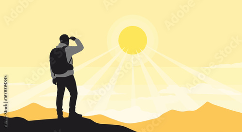 Silhouette of a hiker enjoying the view and the sun illuminating a landscape
