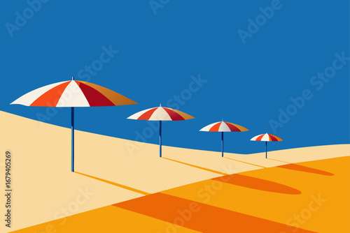 Four striped beach umbrellas cast long shadows on a sandy beach under a clear blue sky