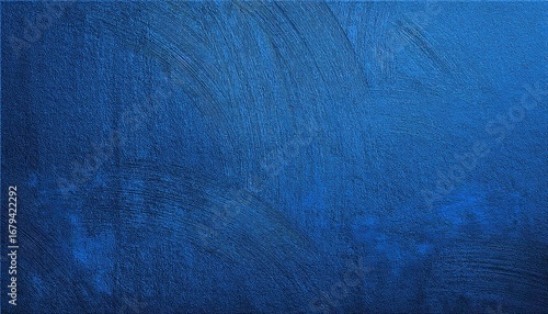 deep cobalt blue textured wall surface with subtle rough patterns and light reflection ideal for modern background or abstract design