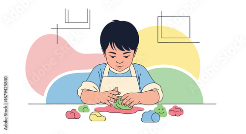 Little boy creating shapes with colorful clay, learning and having fun on the table