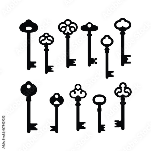 Collection of ten vintage black skeleton keys on a white background antique