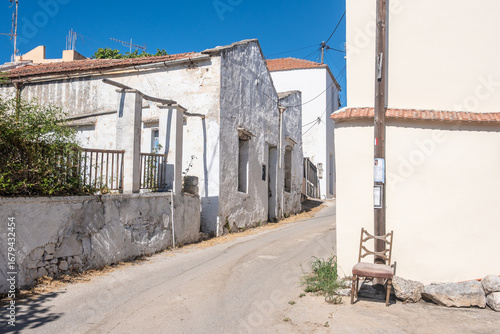 Paved alleys, traditional Cretan architecture, and preserved stone walls lead through the village of Gavalochori, Chania, Crete, Greece.