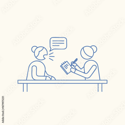 Two individuals engaged in a conversation at a table, one taking notes while the other speaks, with a neutral background