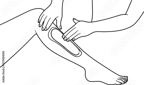 Close up of hands applying wax strip to leg for hair removal