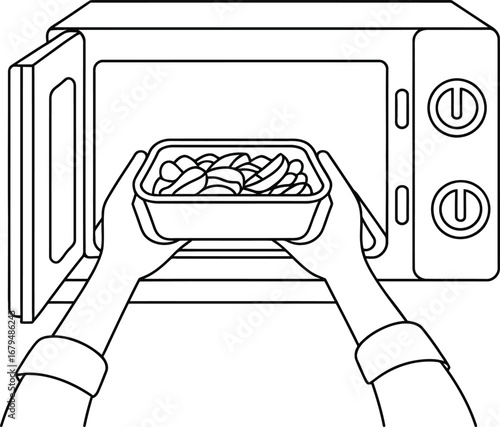 Hands placing a container of food into an open microwave oven