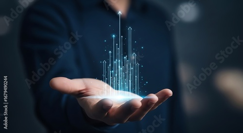 Hand holding futuristic glowing upward arrows showcasing growth and financial success in business