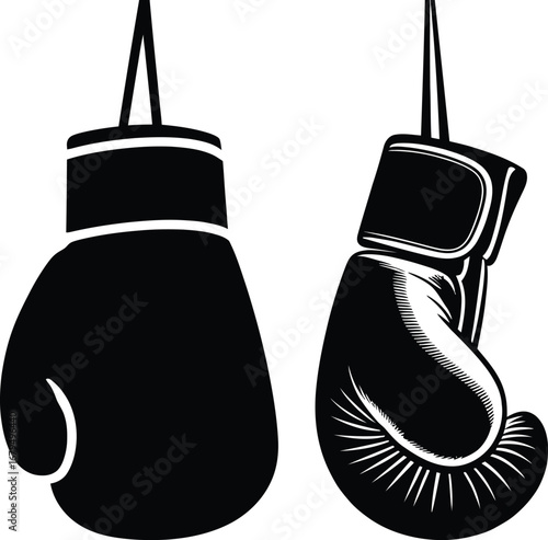 Pair of black boxing gloves hanging isolated on white background