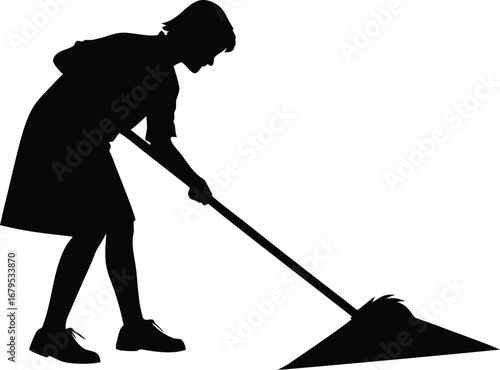 Silhouette of a person sweeping with a broom