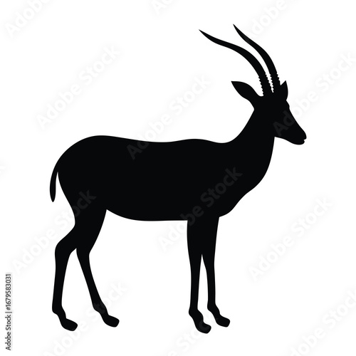 Black silhouette of a standing oryx or gemsbok antelope with long horns