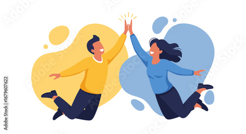 Two joyful people jumping and giving a high five, celebrating success and teamwork.