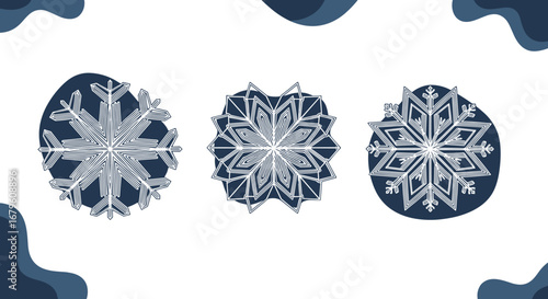 Three intricate snowflake designs in varying shades of blue and white.