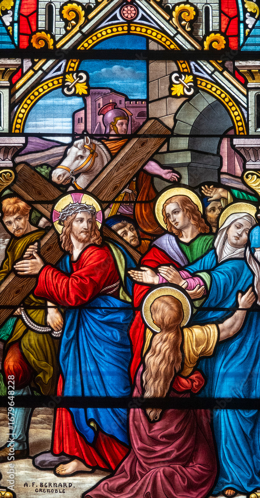 Fototapeta premium Stained glass (1914) of The Way of the Cross. Fourth station: Jesus meets his Blessed Mother.