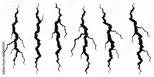 Collection of six black jagged vertical cracks and fissures on a white background