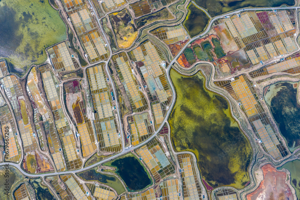 Obraz premium Aerial view of the dramatic landscape of the salt fields of Guerande in France