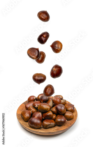 Wallpaper Mural Falling edible sweet whole chestnuts, chest nuts in air isolated on white background Torontodigital.ca