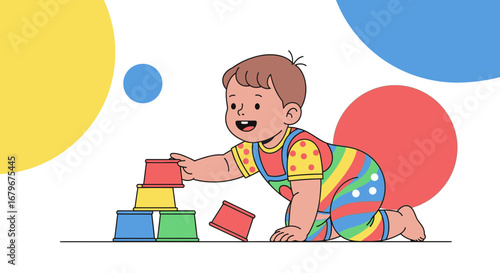 Happy baby building a tower of colorful cups while playing and having fun