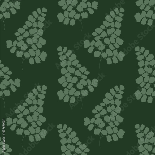 Seamless floral pattern with green maidenhair fern leaf on a dark green background.