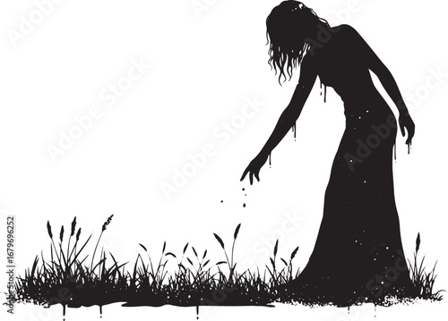 Mysterious silhouette of a woman touching grass under a ray of l