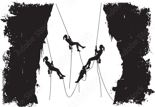 Silhouette of women abseiling down craggy cliffs, challenging de