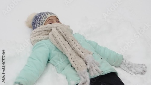 Happy girl with a snow in sunny winter day. Girl enjoys winter, frosty day. Playing with snow on winter holidays, a woman throws white, loose snow into the air. Walk in winter forest.
