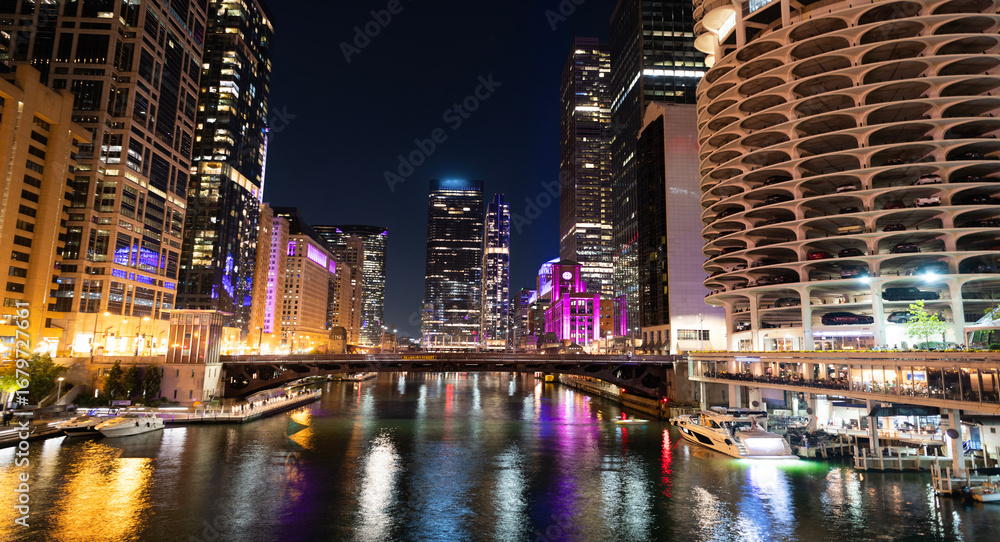 Naklejka premium Skyscraper architecture. Chicago city cityscape. Cityscape night with building. Skyline architecture. Chicago city with illuminated building. Night in Chicago city downtown. Night skyline glow