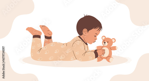Child Laying Down Exploring Teddy Bear, Creating A Moment Of Wonder And Exploration