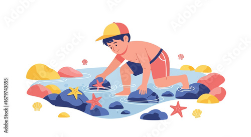 Boy in the water plays with starfish next to the coast enjoying the summer vacation