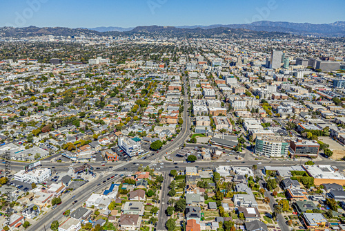 Koreatown, Los Angeles, CA, California, LA County, March 19, 2025: Aerial Drone View toward K-Town City with Homes, Houses, Apartments, Streets, Buildings and Mountain View
