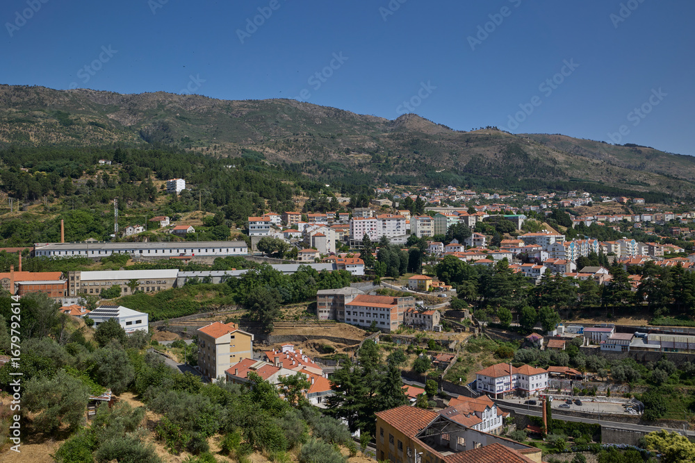 Obraz premium Scenic cityscape of Covilha, Portugal with residential buildings and mountains