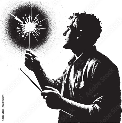 Silhouette of a man holding a lit sparkler celebrating joy and festivities in the dark