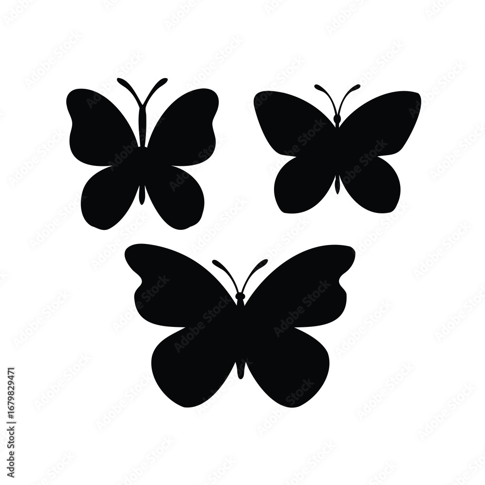 Fototapeta premium Three beautiful butterfly silhouettes in a dynamic arrangement on a white background