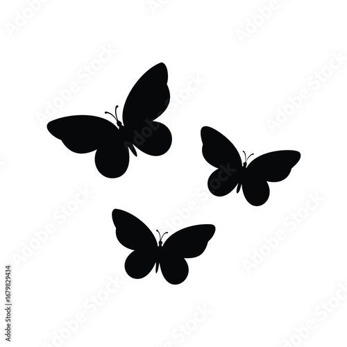 Three black butterflies in silhouette against a white background artistic design