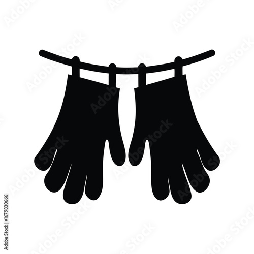 Two Black Gloves Drying on a Clothesline, Hanging in a Silhouette