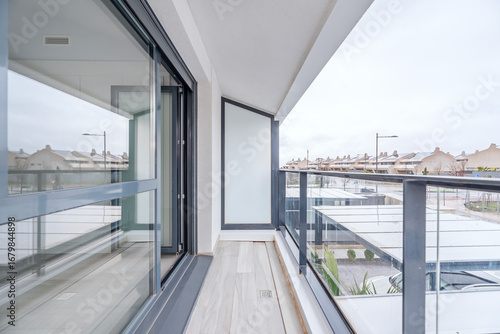 Urban terrace converted into a winter garden with a dark gray aluminum enclosure