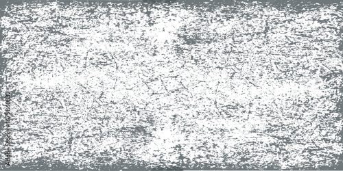 Abstract monochrome texture with a dirty, textured pattern of grunge and gray on a frozen, icy surface