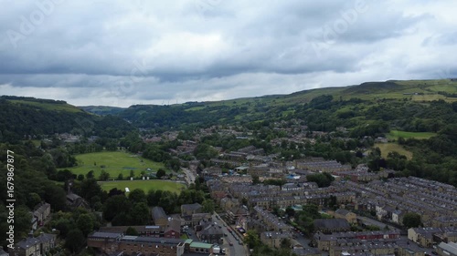 aerial view of the town of Todmorden in West Yorkshire showing the streets public park and surrounding hills