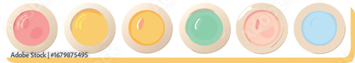 A row of assorted colored cookies displayed on a clean white background, showcasing a variety of shapes and designs.