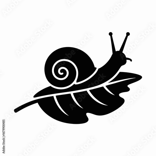 Black silhouette of a snail crawling on a leaf